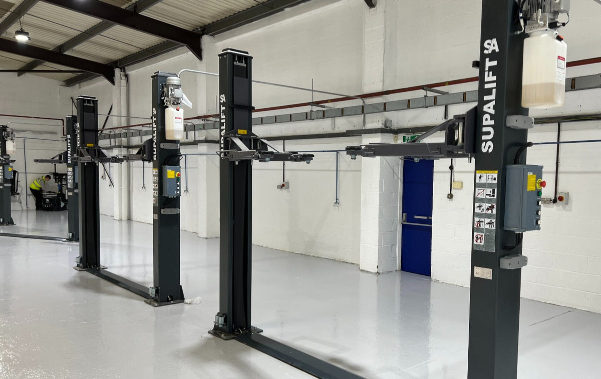 Vehicle lift installed in a workshop